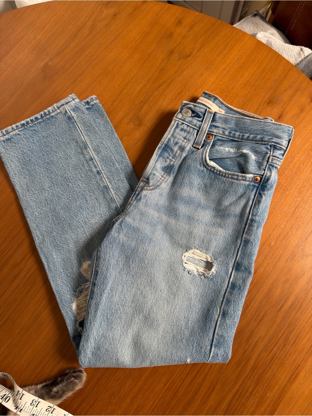 Levi's Light Blue High-Rise Women's Jeans with Distressed Knee